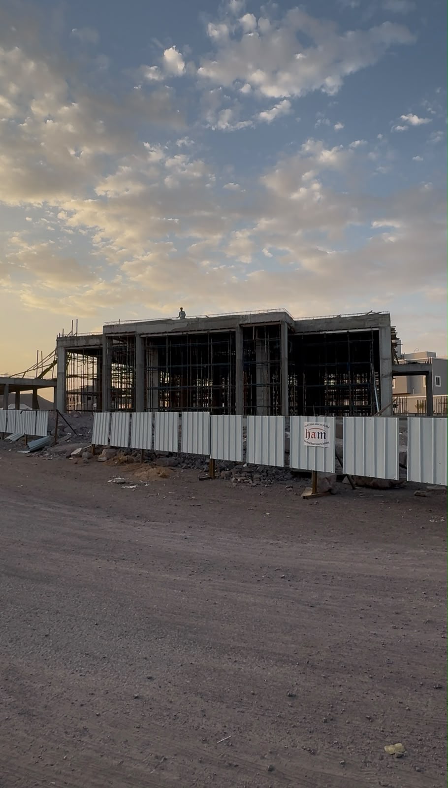 HAM construction site with concrete structure and perimeter fencing
