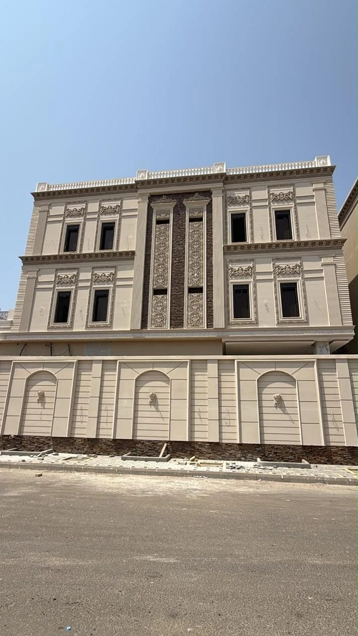 Completed building with a detailed stone-coloured façade from the HAM company portfolio